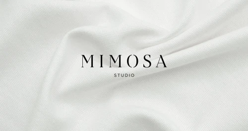 Mimosa Studio wordmark on white fabric